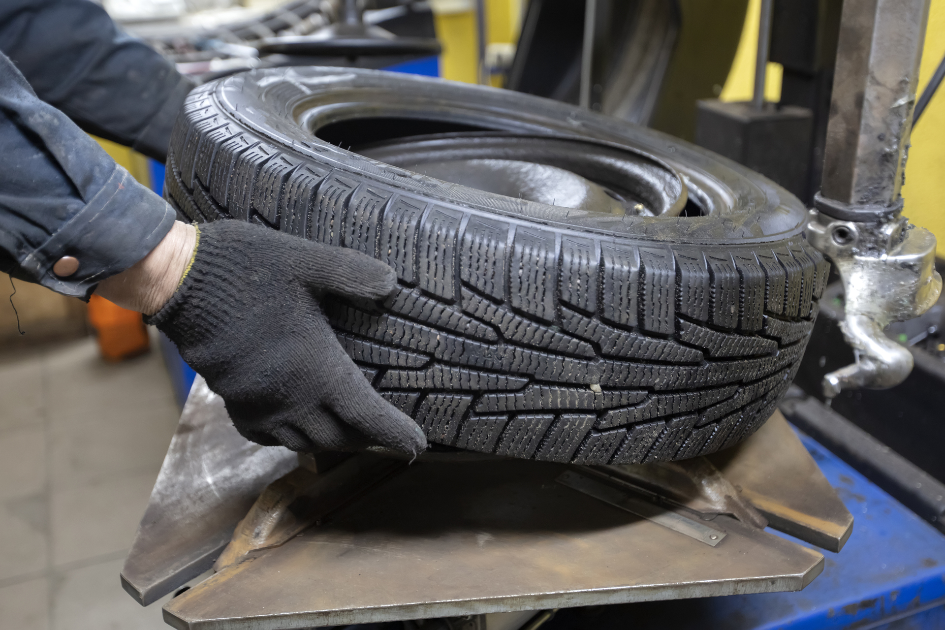 Tire service. The mechanic's hands hold the wheel of the car. Wheel repair. img-9